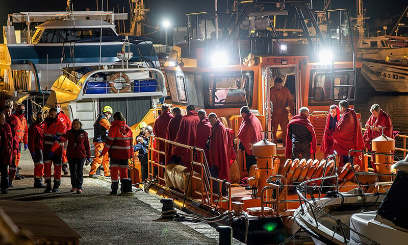 survivors of the sinking of russian cargo ship ursa major stand on the deck of a spanish maritime rescue ship upon arrival at the port of cartagena spain december 23 photo reuters