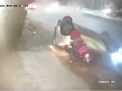delivery rider critically hurt as speeding car overturns at khayaban e ittehad delivery rider critically hurt as speeding car overturns at khayaban e ittehad