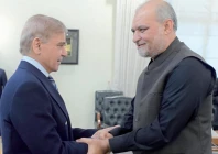 prime minister shehbaz sharif shakes hands with jamaat e islami chief hafiz naeem at the pm house in islamabad photo express