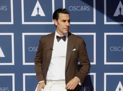 rebel wilson reveals sacha baron cohen as a hole who allegedly tried to suppress her memoir