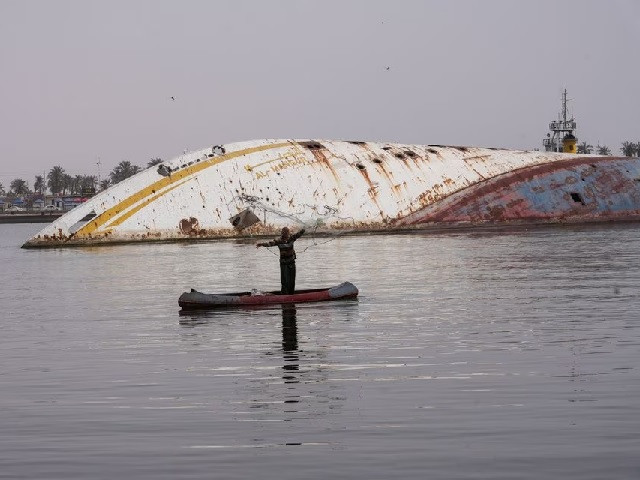 a fisherman casts his net into the waters of shatt al arab near the al mansur yacht once belonging to former iraqi president saddam hussein which has been lying on the water bed for years in the shatt al arab waterway in basra iraq march 9 2023 photo reuters