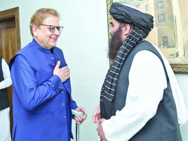afghan foreign minister amir khan muttaqi greets pakistan s special envoy for afghanistan ambassador muhammad sadiq ahead of a meeting in kabul photo express