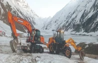 workers of kaghan development authority use heavy machinery to clear the road leading to the scenic lake saiful malook balakot following its reopening to tourists after six months photo zulfiqar ali express