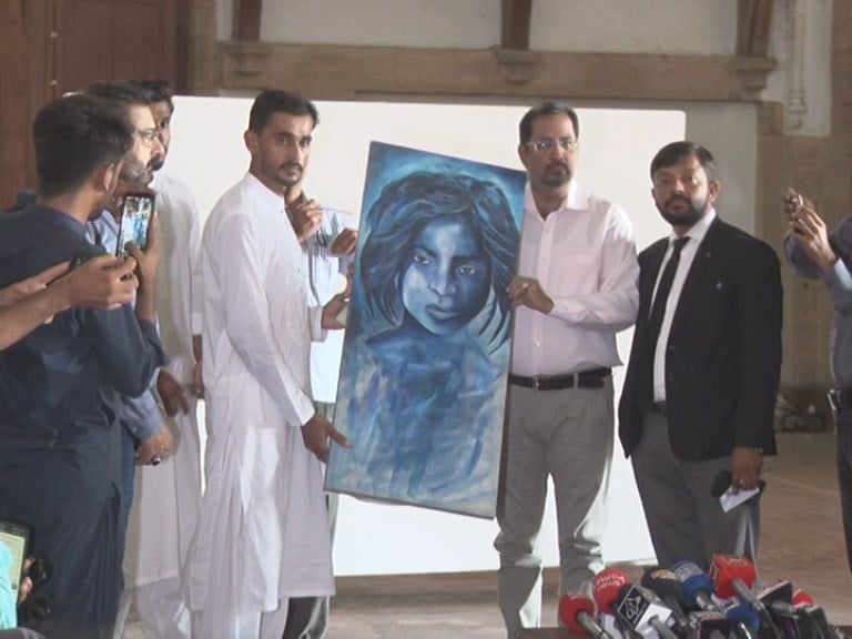 raza abbas senior director of culture and sports at kmc handed over the paintings to saifi soomro in the presence of the media on monday photo express