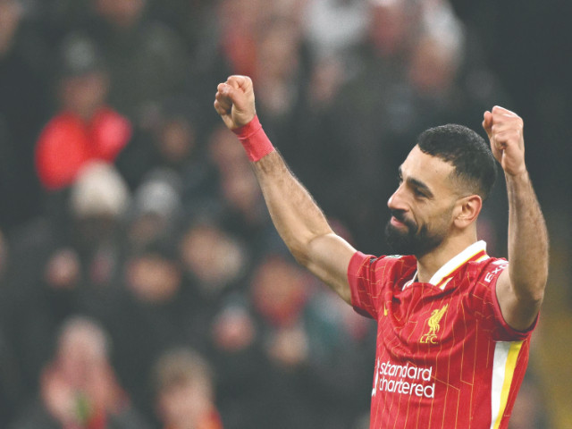 liverpool striker mohamed salah celebrates scoring the team s second goal during the english league cup semi final second leg against tottenham hotspur at anfield on february 6 photo afp