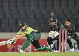 salman ali agha plays a sweep shot during the third odi against bangladesh at dhaka s sher e bangla national stadium on sunday photo afp