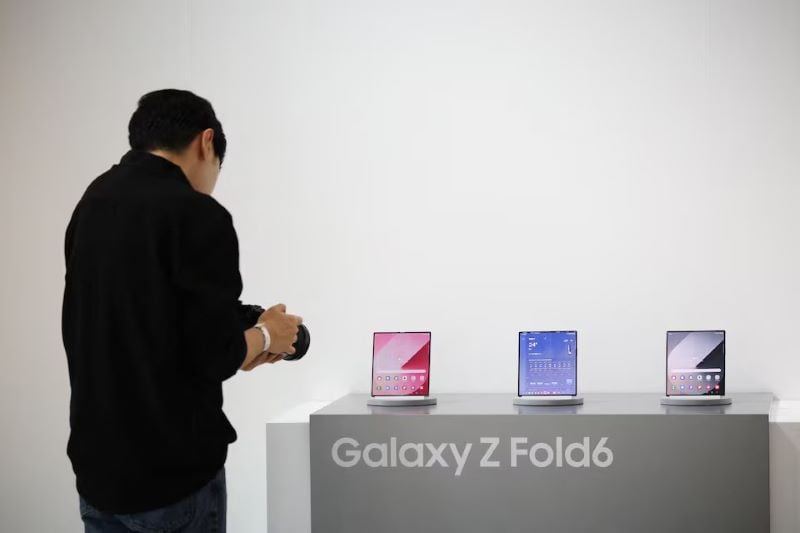 an attendee films samsung electronics new galaxy z fold 6 during its unveiling ceremony in seoul south korea july 8 2024 photo reuters