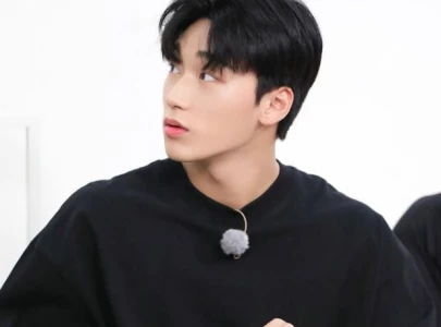 ateez s san stuns dolce gabbana crowd with statue esque look at alta moda event