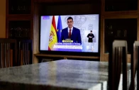 a tv screen shows live broadcast of spain s prime minister pedro sanchez as he delivers a statement to address the latest international developments after us president donald trump said that the us would cut off all trade with spain photo reuters