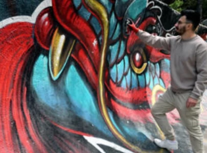 street artists from sarajevo paint over bullet holes from bosnian war street artists from sarajevo paint over bullet holes from bosnian war