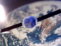 a satellite model is placed on a picture of earth in this illustration taken november 25 2024 reuters