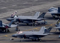 personnel work on us air force f 35 lightning ii fighter jets parked on the tarmac at the former roosevelt roads naval base in ceiba puerto rico january 3 2026 reuters
