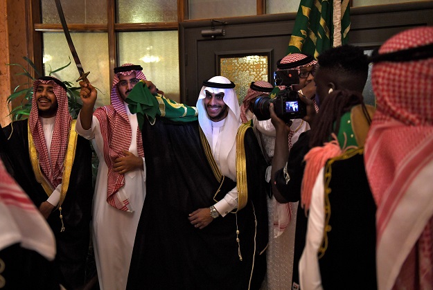 Saudi groom Basil Albani dances with his friends at his home during his wedding in the Red Sea resort of Jeddah. PHOTO: AFP