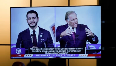 democratic nominee for us senate abdul el sayed and republican nominee for us senate mike rogers are seen on a screen in the media room during their us senate debate in southfield michigan us october 21 2026 reuters