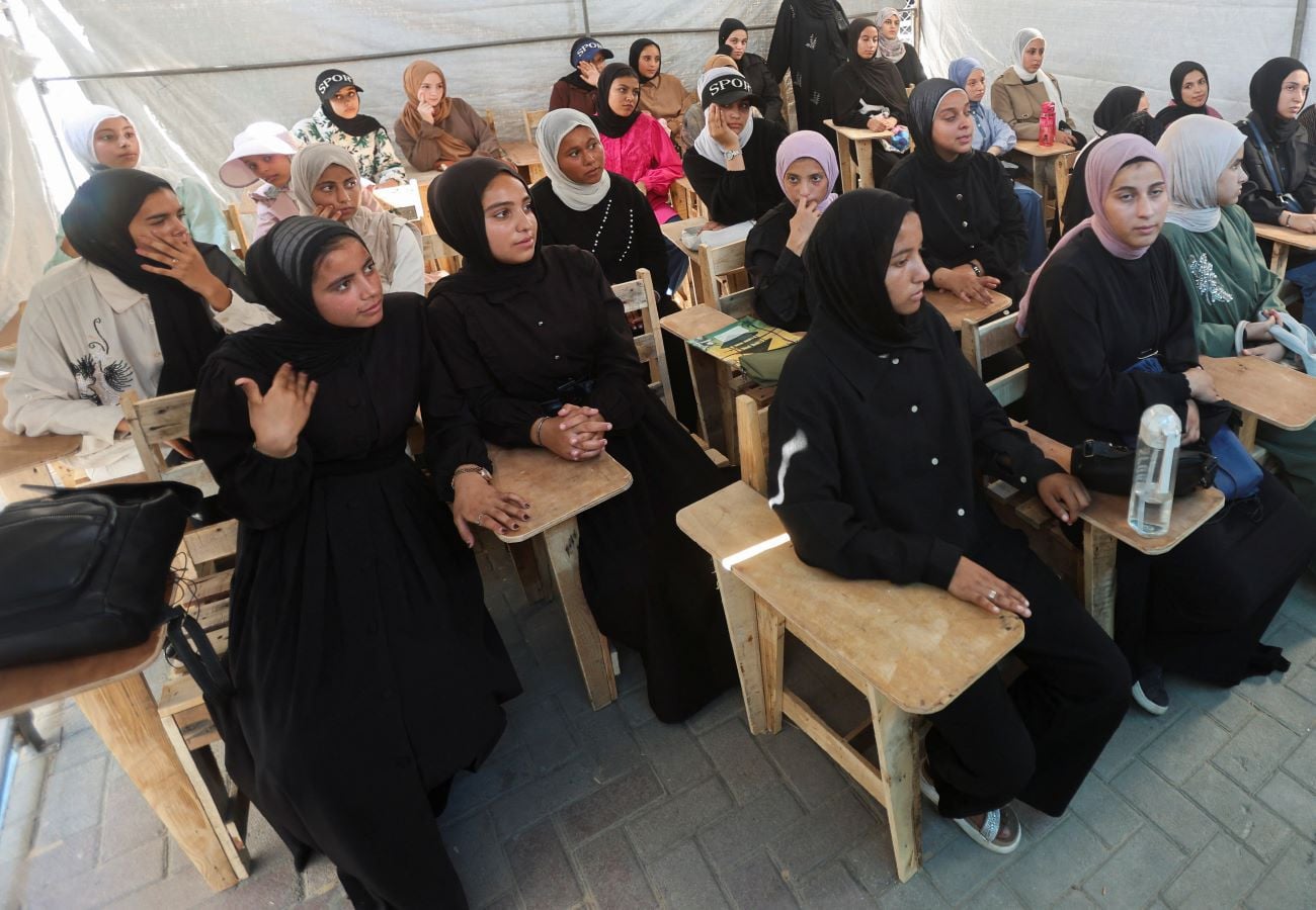 Displaced Palestinian student Samar Abu Salmi, 15, sits with other female students inside a tent classroom in Khan Younis, in the southern Gaza Strip, September 20, 2026. REUTERS