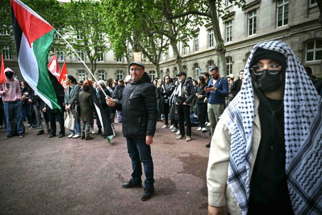 a person waves a palestinina flag during a pro palestinian demonstration in the courtyard of the institute of political studies sciences po building in lyon central eastern france on april 30 2024 in an echo of tense demonstrations rocking many top us universities students at sciences po paris have staged a number of protests with some students furious over the israel hamas war and ensuing humanitarian crisis in the besieged palestinian territory of gaza photo by olivier chassignole afp a person waves a palestinina flag during a pro palestinian demonstration in the courtyard of the institute of political studies sciences po building in lyon central eastern france on april 30 2024 in an echo of tense demonstrations rocking many top us universities students at sciences po paris have staged a number of protests with some students furious over the israel hamas war and ensuing humanitarian crisis in the besieged palestinian territory of gaza photo by olivier chassignole afp