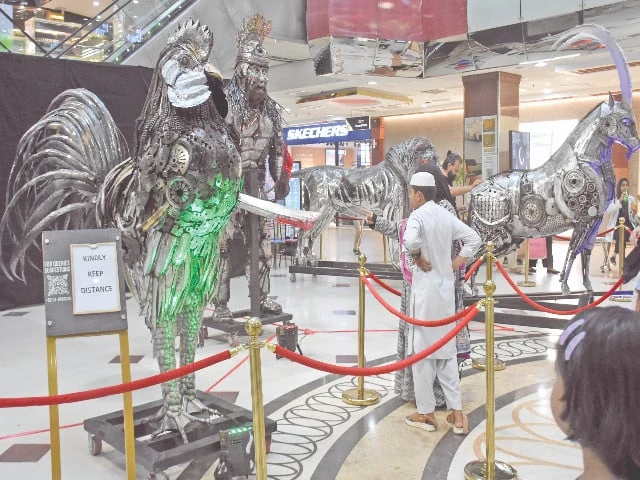 sculptures made of metal scrap on display at a mall in islamabad photo online