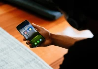 a high school student poses with his mobile phone showing his social media applications in melbourne australia november 28 2024 source reuters