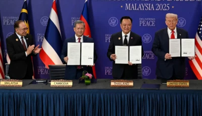 malaysia s prime minister anwar ibrahim applauds as cambodia s prime minister hun manet thailand s prime minister anutin charnvirakul and u s president donald trump hold up documents during the ceremonial signing of a ceasefire agreement between thailand and cambodia source reuters