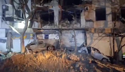 damage to a building and vehicles in the aftermath of a reported strike amid the u s  israeli conflict with iran in tehran iran march 28 2026 in this screengrab from video photo reuters