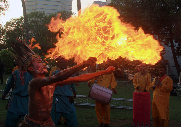 Baloch dancers perform to folk music known as Leva. PHOTO: ATHAR KHAN