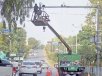 workers install cctv cameras on a pole at aabpara chowk in the federal capital as part of enhanced security measures being taken ahead of the multiple long marches announced for the weekend photo online