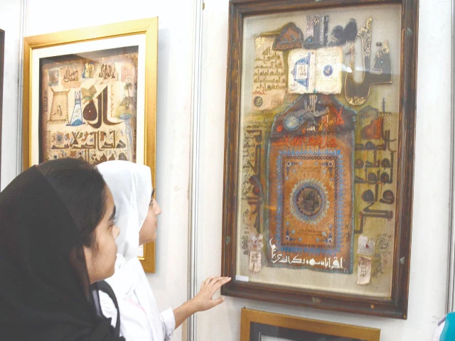 students look at a calligraphic masterpiece in fascination at the calligraphy exhibition held as part of the 2nd international seerat festival 2025 at fg home economics college in sector f11 islamabad photo inp