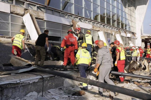 rescue service workers inspect a scene after a roof collapsed at a railway station in novi sad serbia on nov 1 photo afp rescue service workers inspect a scene after a roof collapsed at a railway station in novi sad serbia on nov 1 photo afp