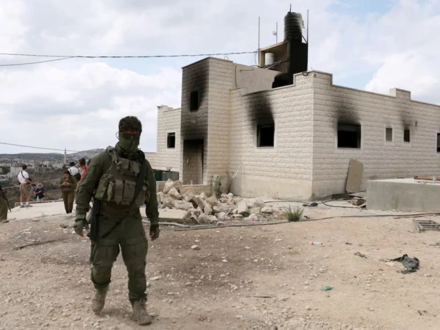 Israeli settlers attack West Bank village, blocking family's return home