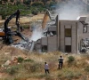 palestinians observe as heavy machinery demolishes a palestinian house near hebron in the israeli occupied west bank june 8 2026 reuters