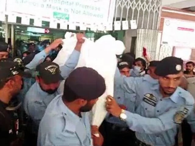 shahbaz gill is being escorted by police to a local islamabad court on august 22 screengrab