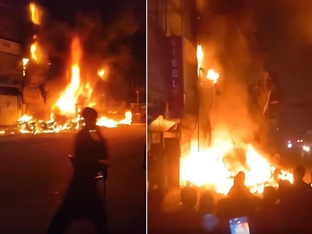 the fire which erupted at the unauthorised petrol pump and an adjoining tyre shop quickly spread to the building above trapping residents screengrabs