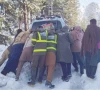 locals and rescue workers work together to push a vehicle stranded by heavy snowfall in shangla as harsh winter conditions continue to disrupt daily life photo express