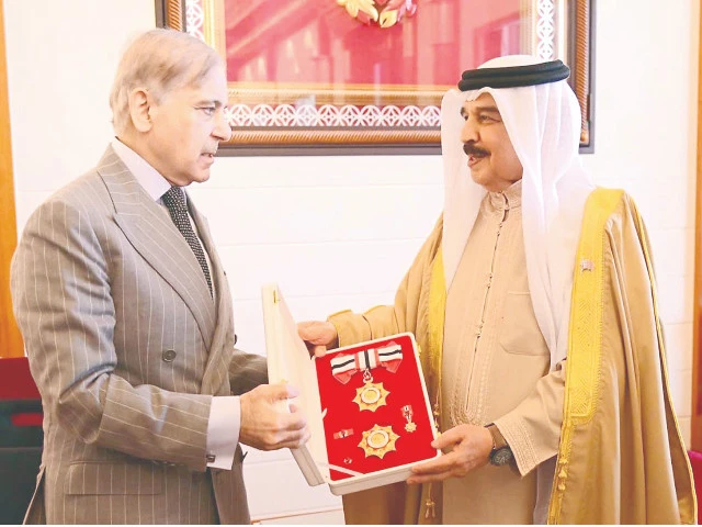 king of bahrain hamad bin isa al khalifa confers the order of bahrain upon prime minister shehbaz sharif in manama photo inp