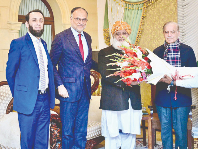 rime minister shehbaz sharif presents a bouquet to jui f chief maulana fazlur rehman photo online