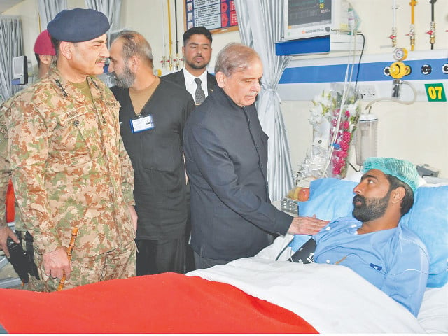 prime minister shehbaz sharif and coas gen asim munir meet with an injured soldier in quetta photo express