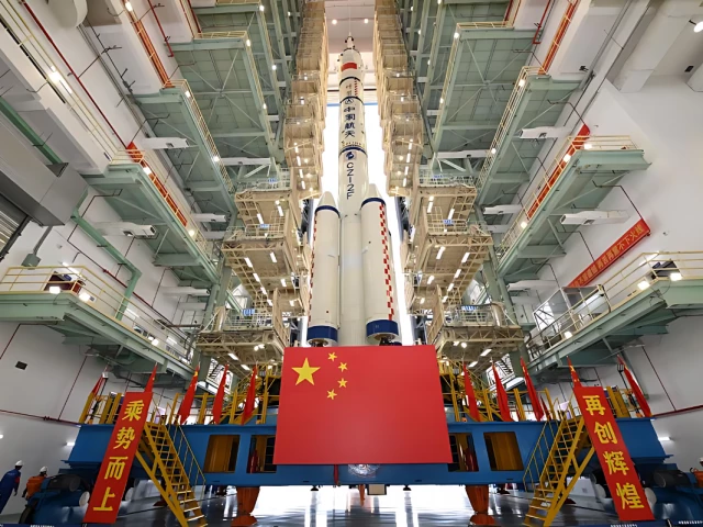 this photo taken on april 16 2025 shows the combination of the shenzhou 20 crewed spaceship and a long march 2f carrier rocket preparing to be transferred to the launching area photo xinhua this photo taken on april 16 2025 shows the combination of the shenzhou 20 crewed spaceship and a long march 2f carrier rocket preparing to be transferred to the launching area photo xinhua