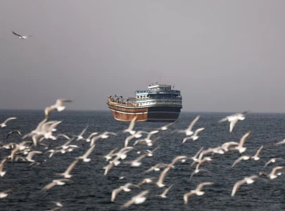 iran reimposes control over strait of hormuz as ships report gunfire