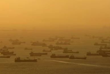 shipping vessels and oil tankers line up on the eastern coast of singapore in july 2015 photo reuters