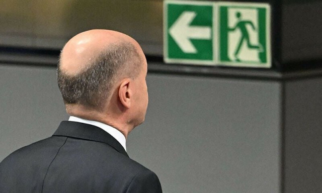 german chancellor olaf scholz walks towards an exit sign following a vote of confidence against himself in a plenary session at the bundestag in berlin germany on december 16 photo afp german chancellor olaf scholz walks towards an exit sign following a vote of confidence against himself in a plenary session at the bundestag in berlin germany on december 16 photo afp