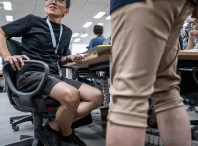 too hot buttoned up tokyo officials ditch suits for cool shorts too hot buttoned up tokyo officials ditch suits for cool shorts