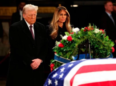 trump and melania attend jimmy carter s lying in state
