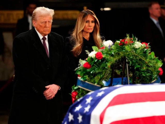 trump and melania attend jimmy carter s lying in state