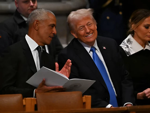trump and obama s rare meeting at carter s funeral analysed by lip readers