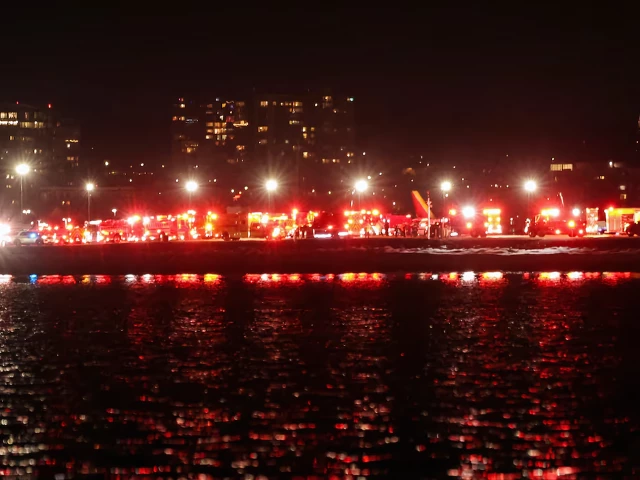 emergency vehicles converge on the crash site after american eagle flight 5342 collided with a helicopter near reagan national airport and plunged into the potomac river reuters