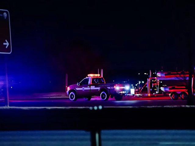 Photo: Photo: A search and rescue boat operates in the Potomac River after American Eagle flight 5342 collided with a helicopter near Ronald Reagan Washington National Airport.