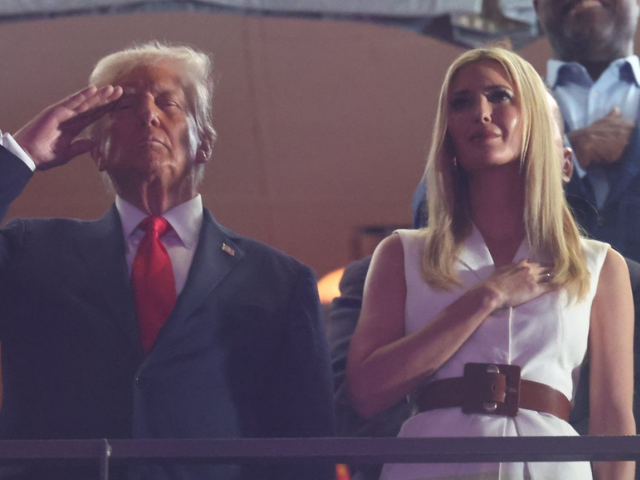 Photo: President Trump, alongside his daughter Ivanka, during the national anthem/Reuters