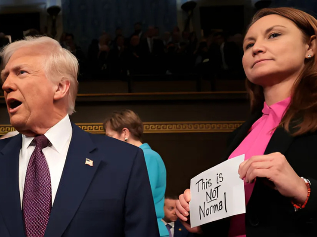 photo rep melanie stansbury holds a sign reading this is not normal as president trump arrives for his speech