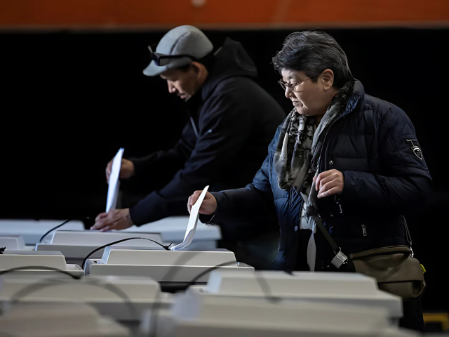 photo people cast their votes inside the polling station during the general election in nuuk greenland reuters