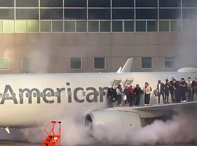 american airlines plane catches fire in denver passengers evacuated